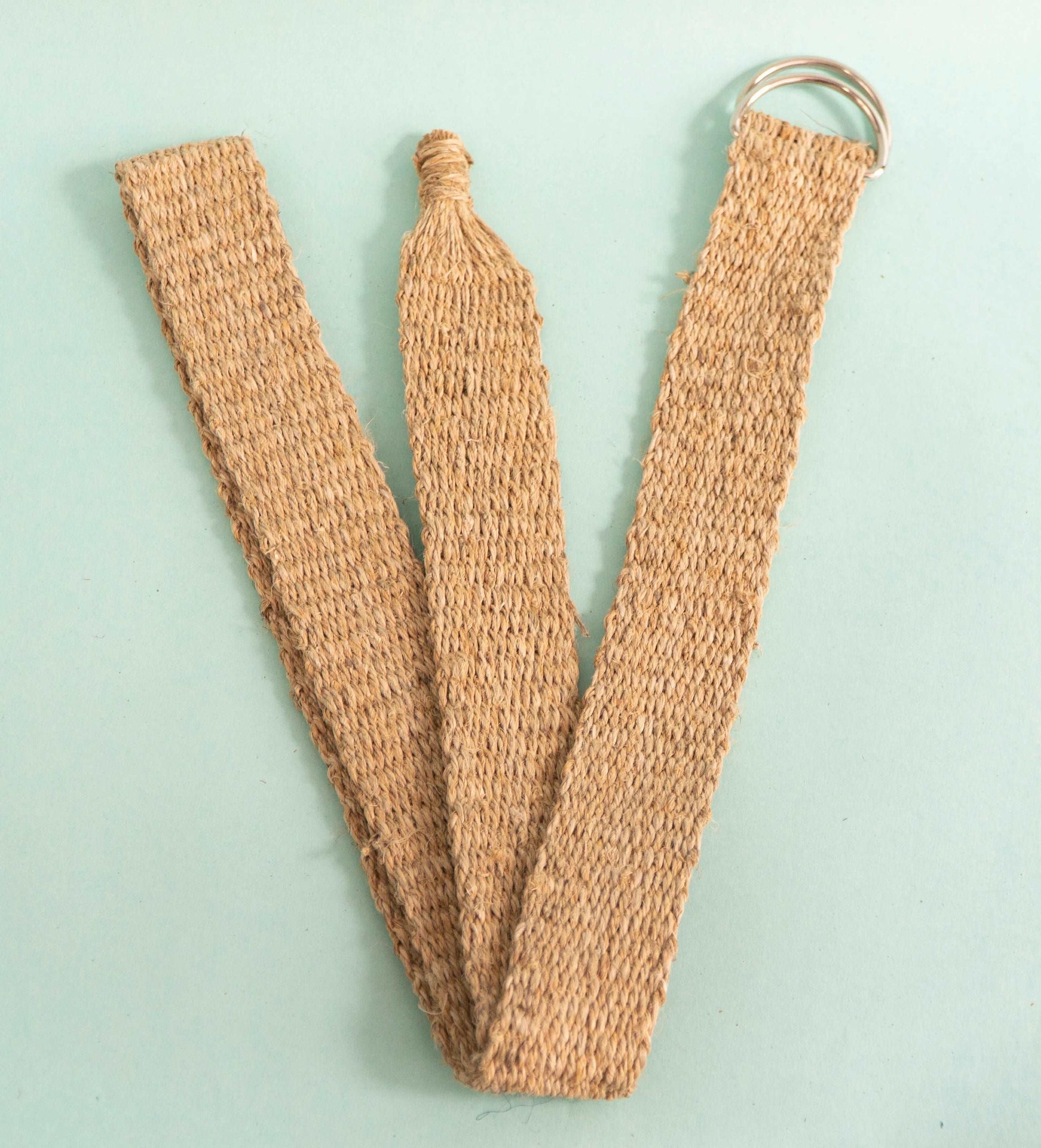 Handcrafted hemp belt folded neatly, highlighting its flexibility and craftsmanship.