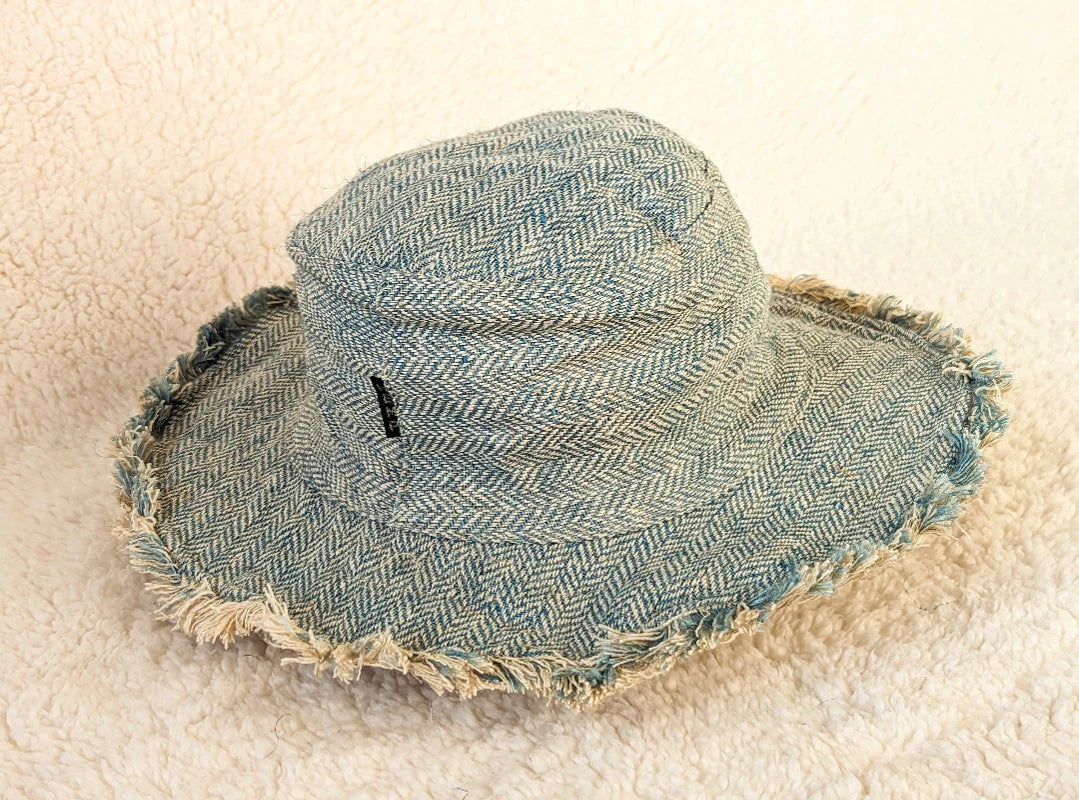 Front view of handcrafted hemp summer hat with wire brim for customizable shaping.