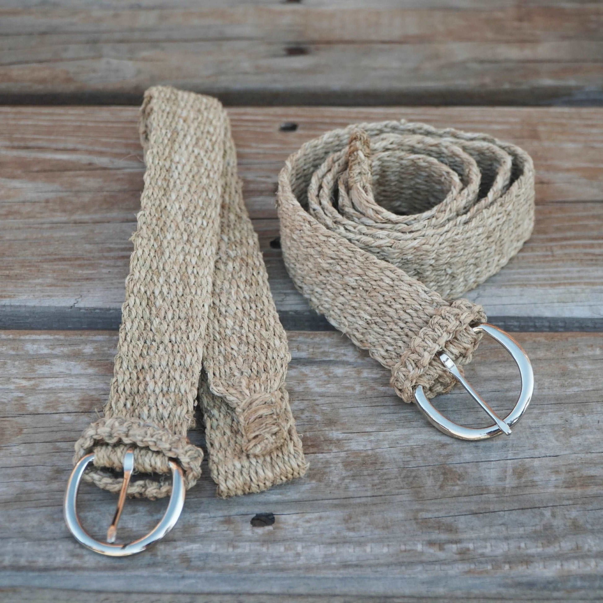 Two sizes of handcrafted hemp belts displayed side by side: small, medium.