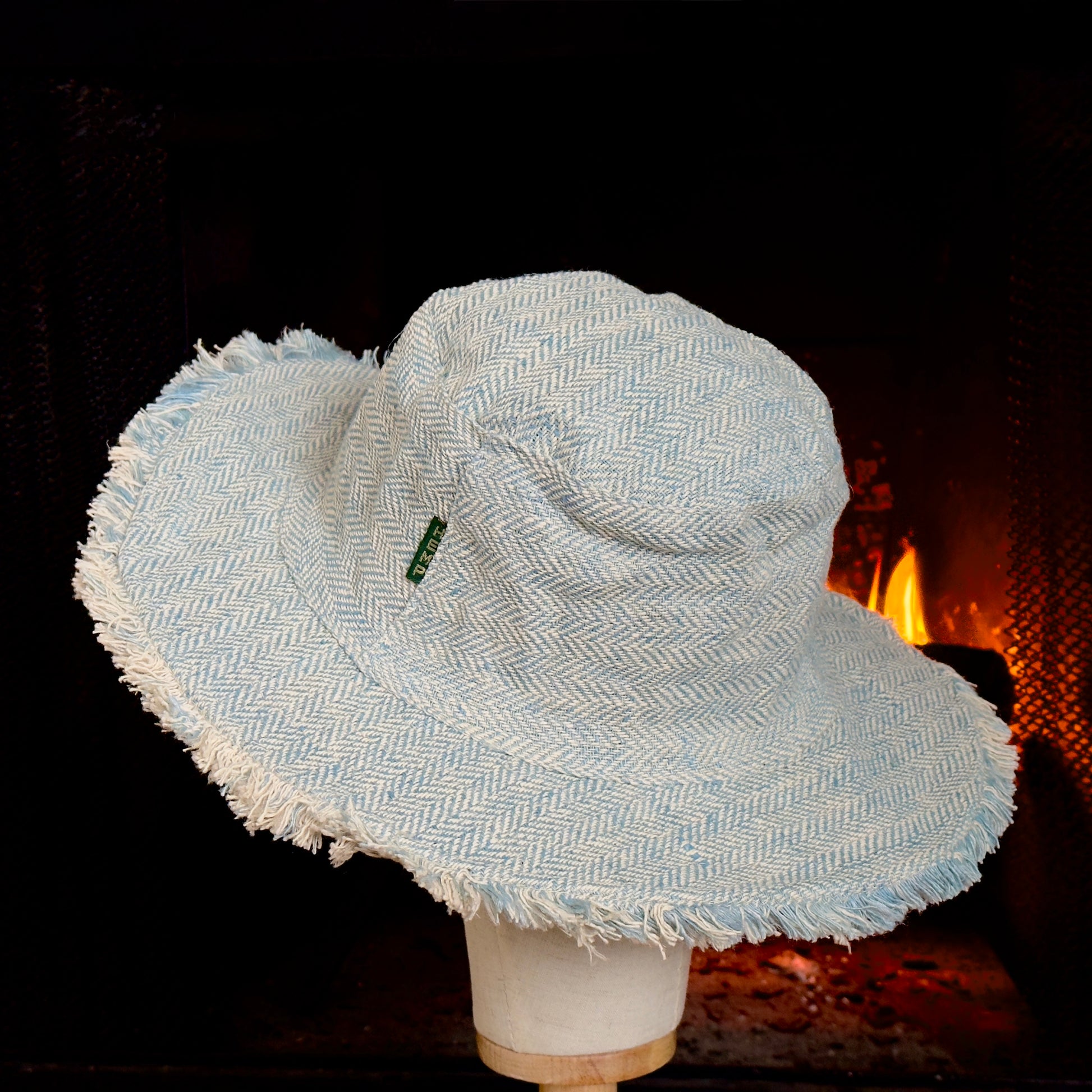  Side view of lightweight and breathable hemp sun hat for outdoor activities.